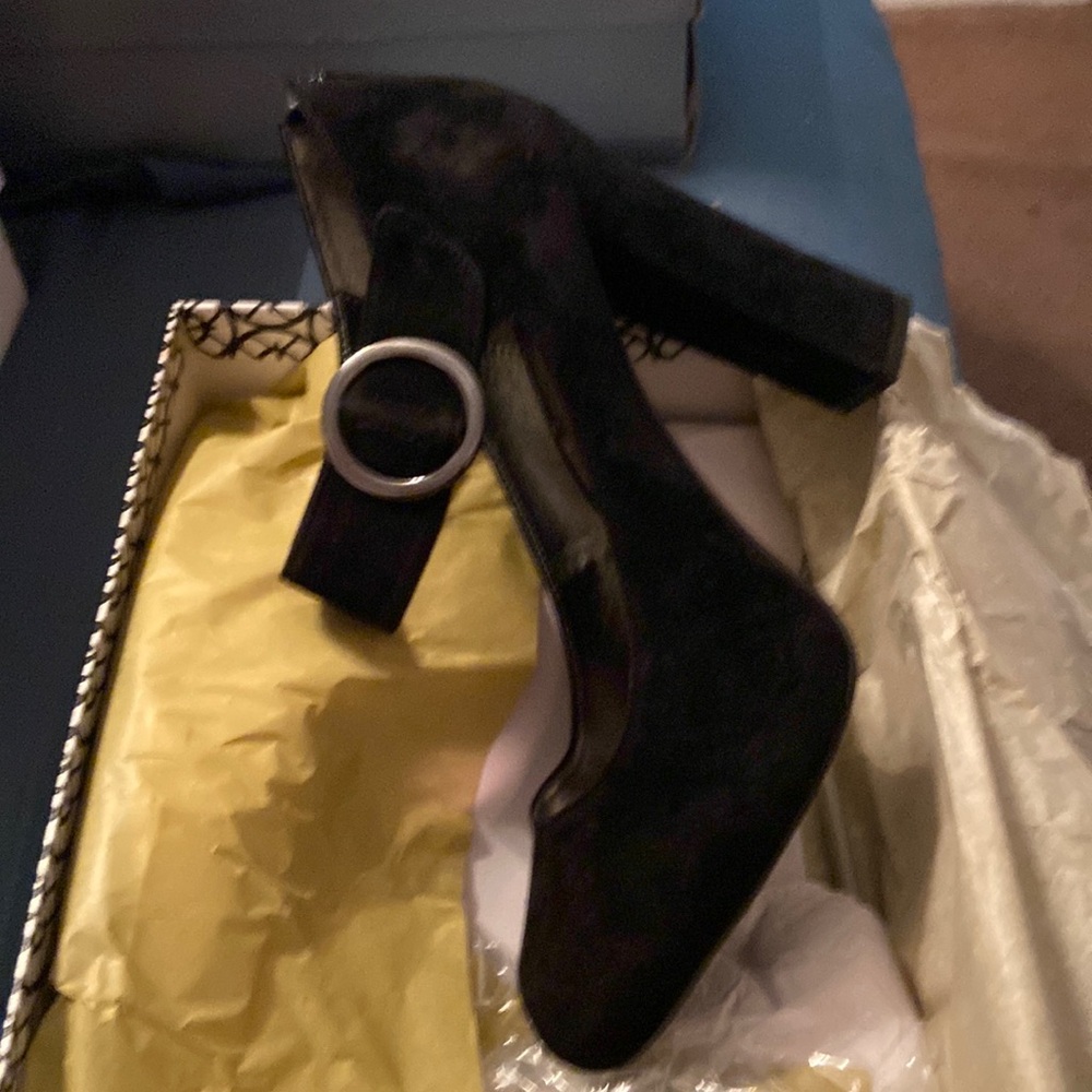 Black suede buckle ankle. Never worn
